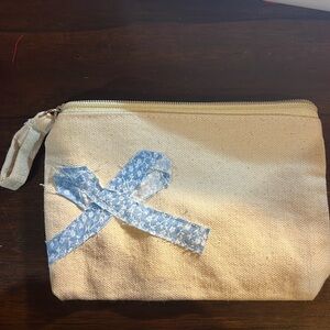 Zipper pouch with blue bow